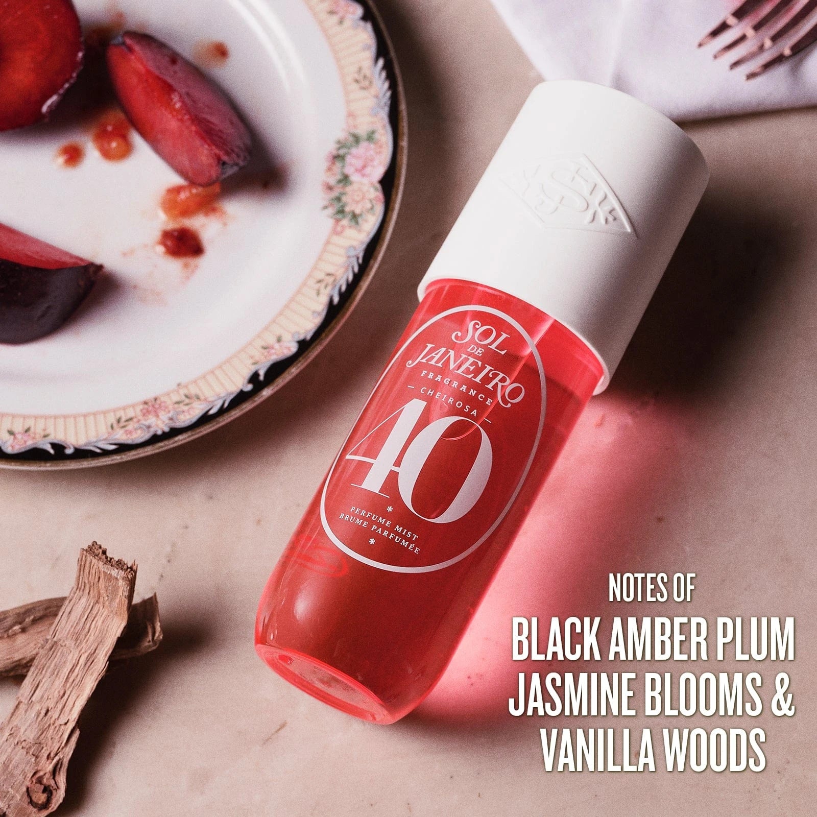 Image on text reads notes of black amber plum, jasmine blooms and vanilla woods. This is an image of sol de janeiro cheirosa 40 perfume mist scent notes