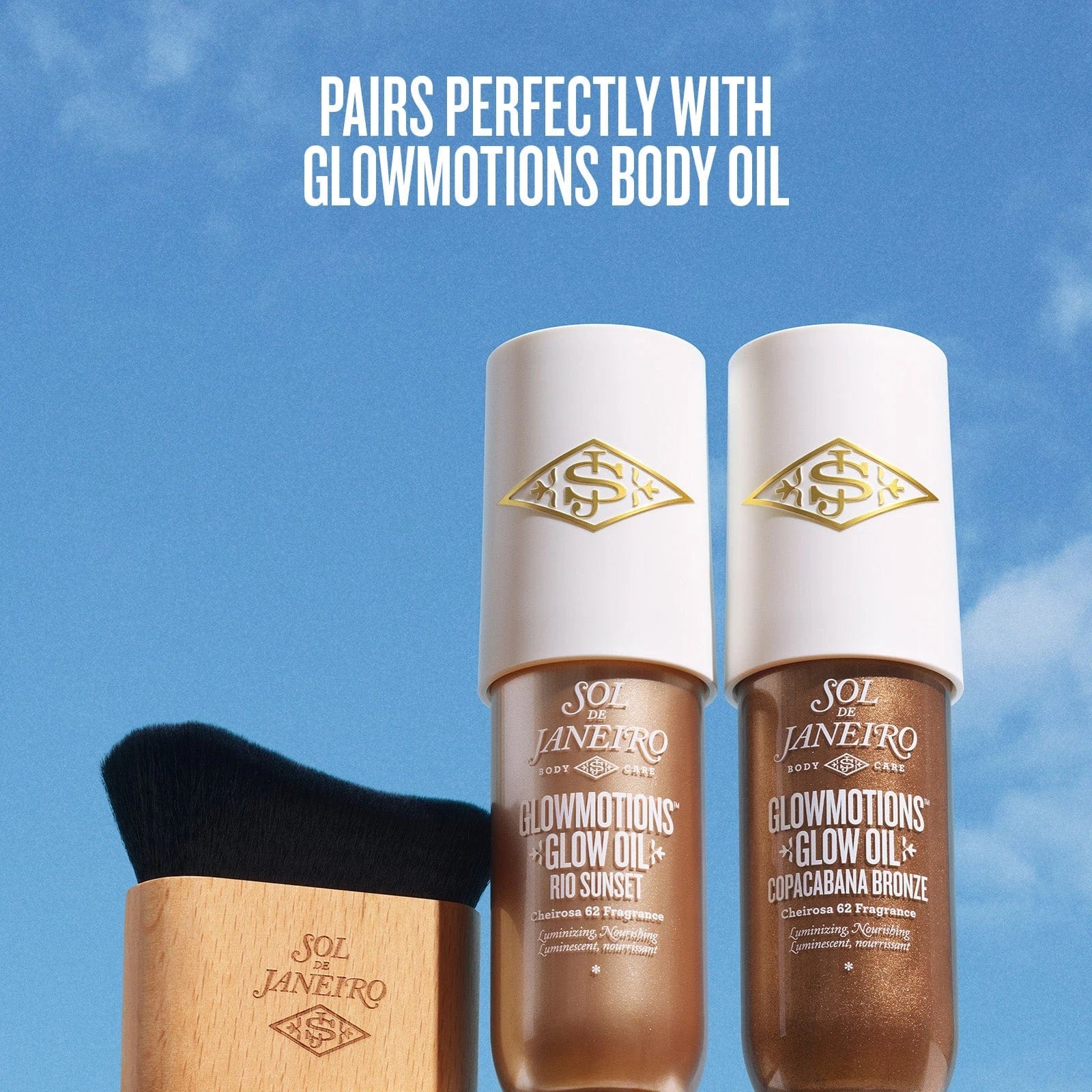 text on the image reads pairs perfectly with glowmotions body oil. This image is showing the brush and sol de janeiro glowmotions body oil rio sunset and copacabana shade