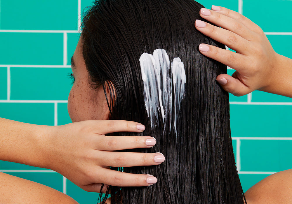 woman touching her hair