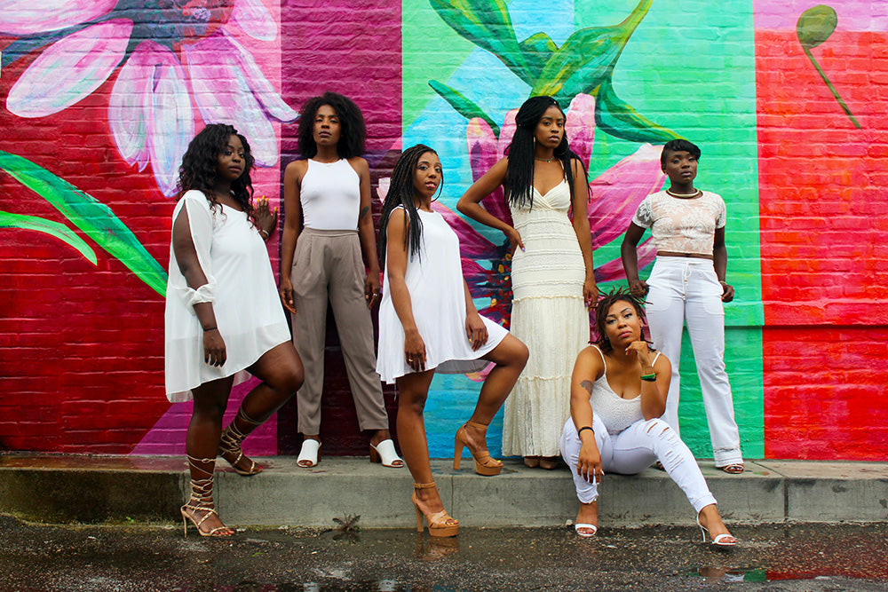 six women wearing white pants posing | Clarke Sanders - https://unsplash.com/@clar_san