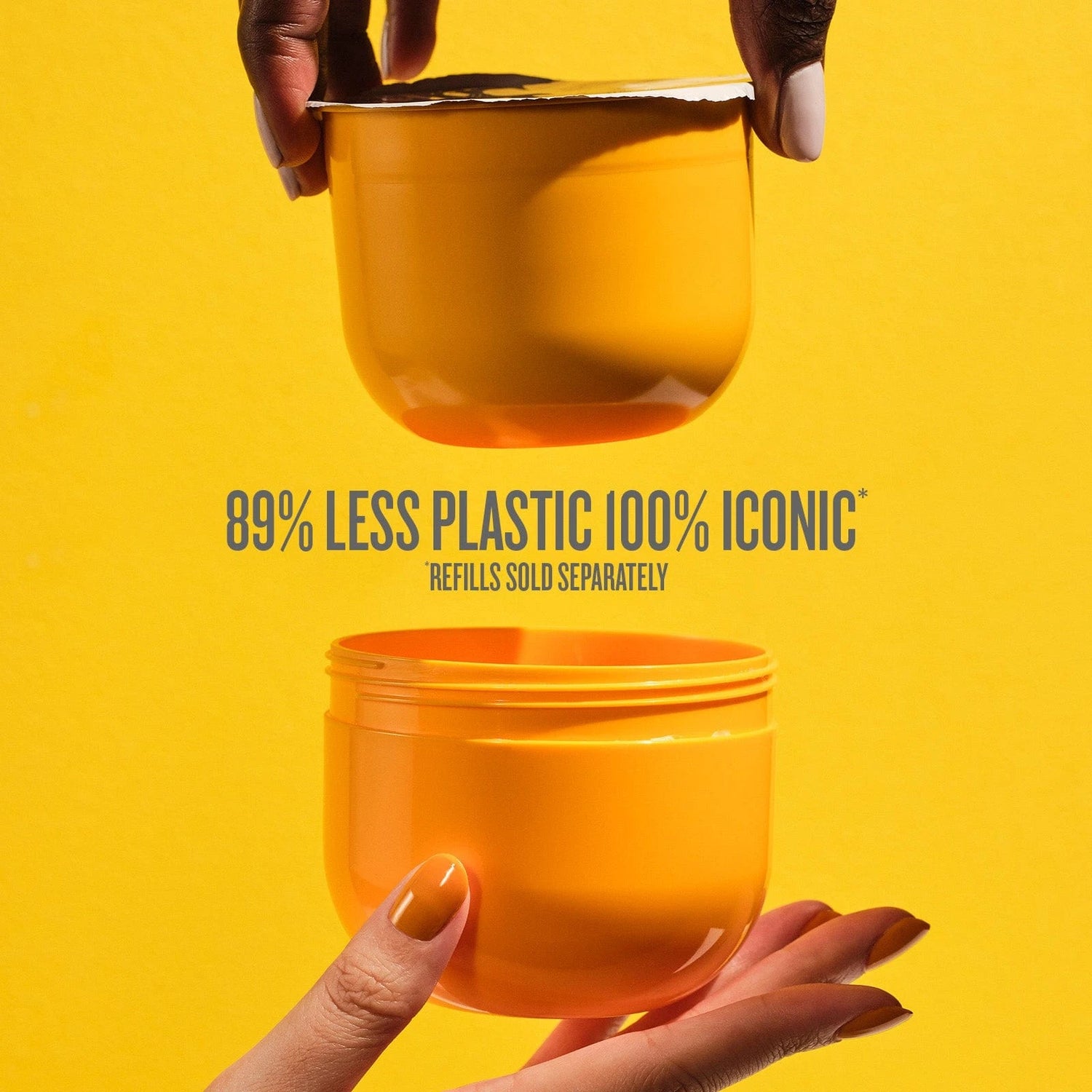 This image is a yellow background with two hands holding one end of the Sol de Janeiro Brazilian Bum Bum Cream refill pod and the refill insert. The text on the image reads as follows &quot;89% less plastic 100% iconic refills sold separately.&quot; in grey text