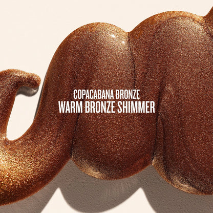 Text on image reads copacabana bronze warm bronze shimmer. This is a close up of a goop product shot of sol de janeiro glowmotions glow body oil in copacabana bronze